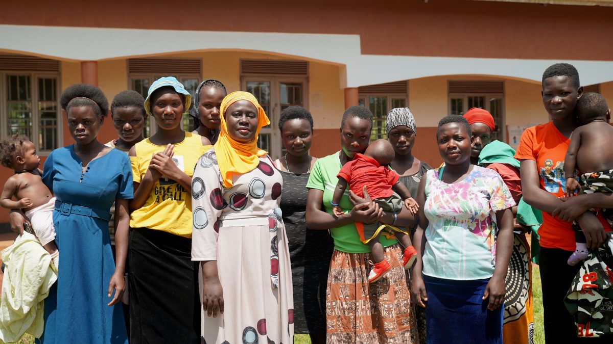 Nakayiza Amina (with yellow scarf), headteacher of the Uganda Muslim Education Association primary school in Kisimba, standing with a group of girls who left school because they were pregnant but were able to return to school to sit their exams.